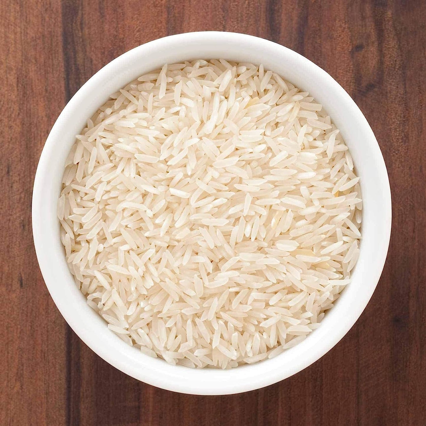 a white bowl of noodles and a white bowl