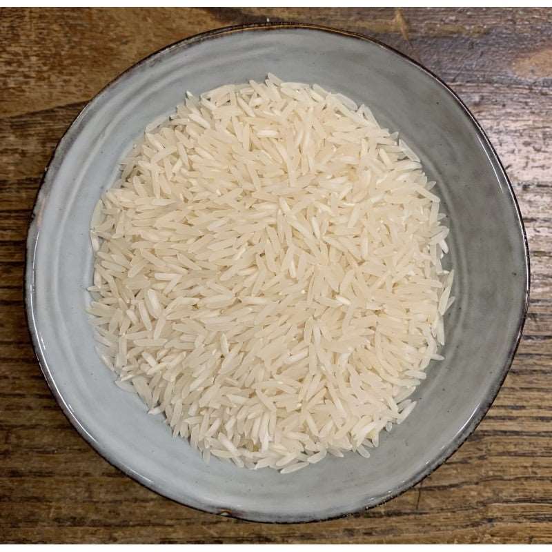 a bowl of rice with a spoon in it