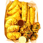 Coffret ramadan contenant des encas pakistanais tels que des samosas faits maison, des nems, des kachoris ainsi que des pakoras (beignets) aux épinards 