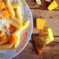 a close up of a plate of food with french fries 